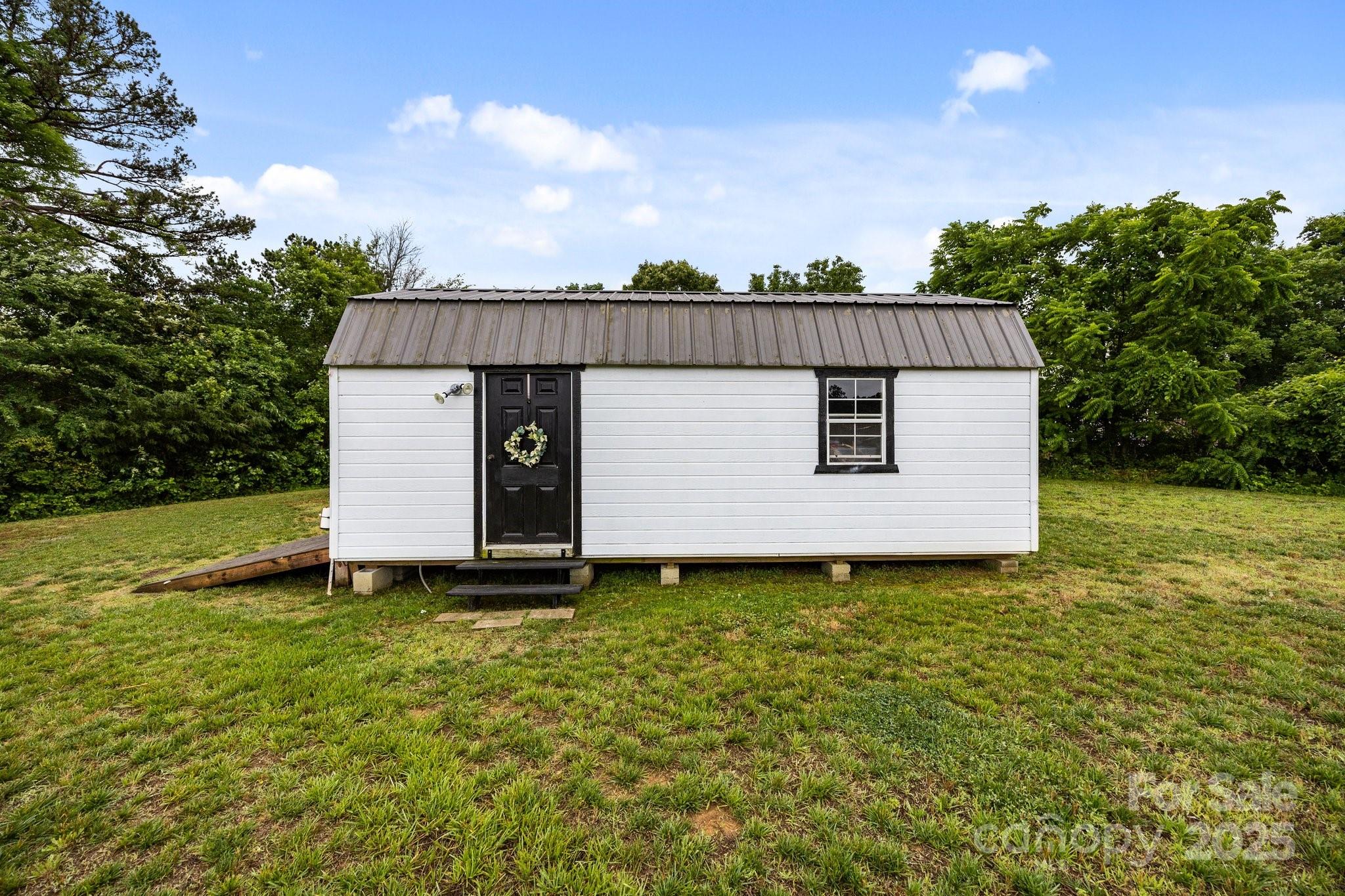 3855 East Holly Grove Road Lexington, NC 27292 - Photo 38 of 42 a front view of a house with garden
