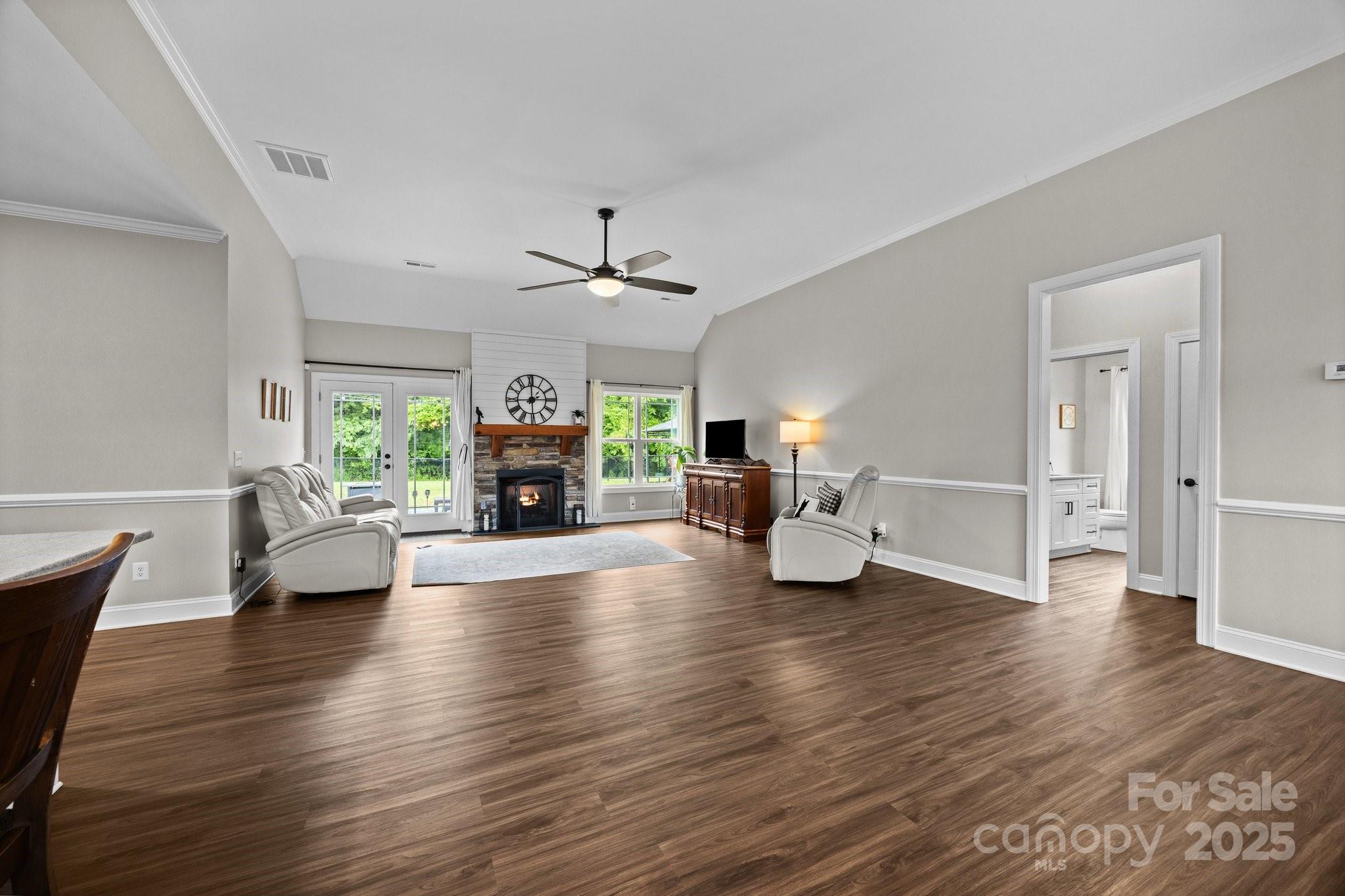 3855 East Holly Grove Road Lexington, NC 27292 - Photo 6 of 42 a living room with fireplace furniture and a wooden floor