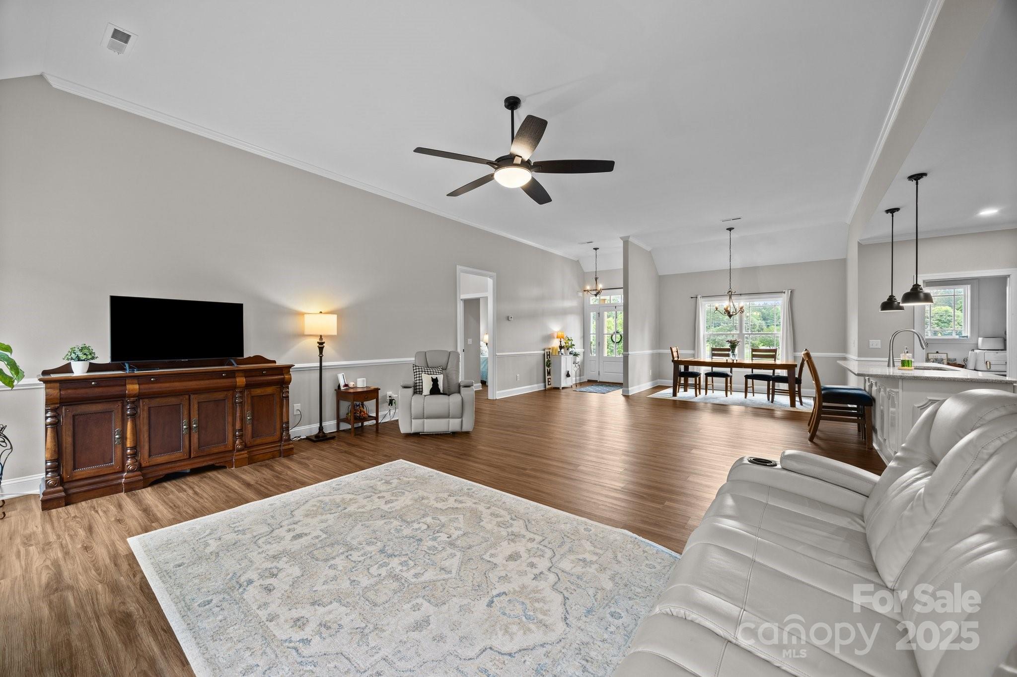 3855 East Holly Grove Road Lexington, NC 27292 - Photo 8 of 42 a living room with furniture and a flat screen tv