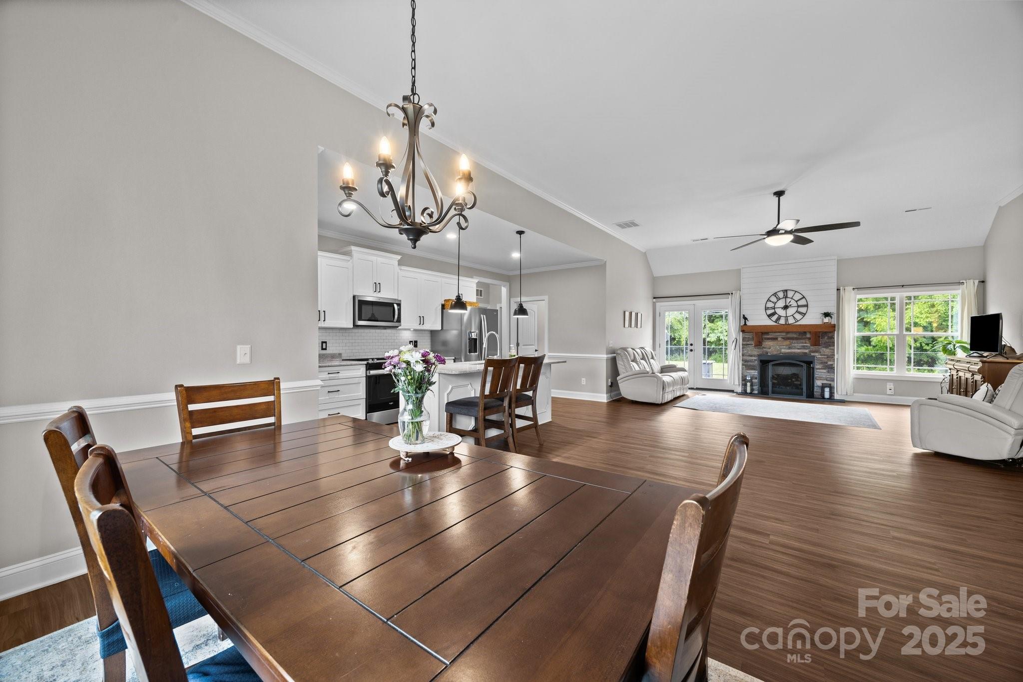3855 East Holly Grove Road Lexington, NC 27292 - Photo 10 of 42 a living room with furniture and a fireplace