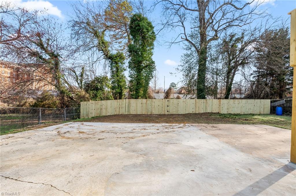 1406 Chatham Drive High Point, NC 27265 - Photo 40 of 48 Brand New Privacy rear fence! AND what about this Massive patio/parking??
