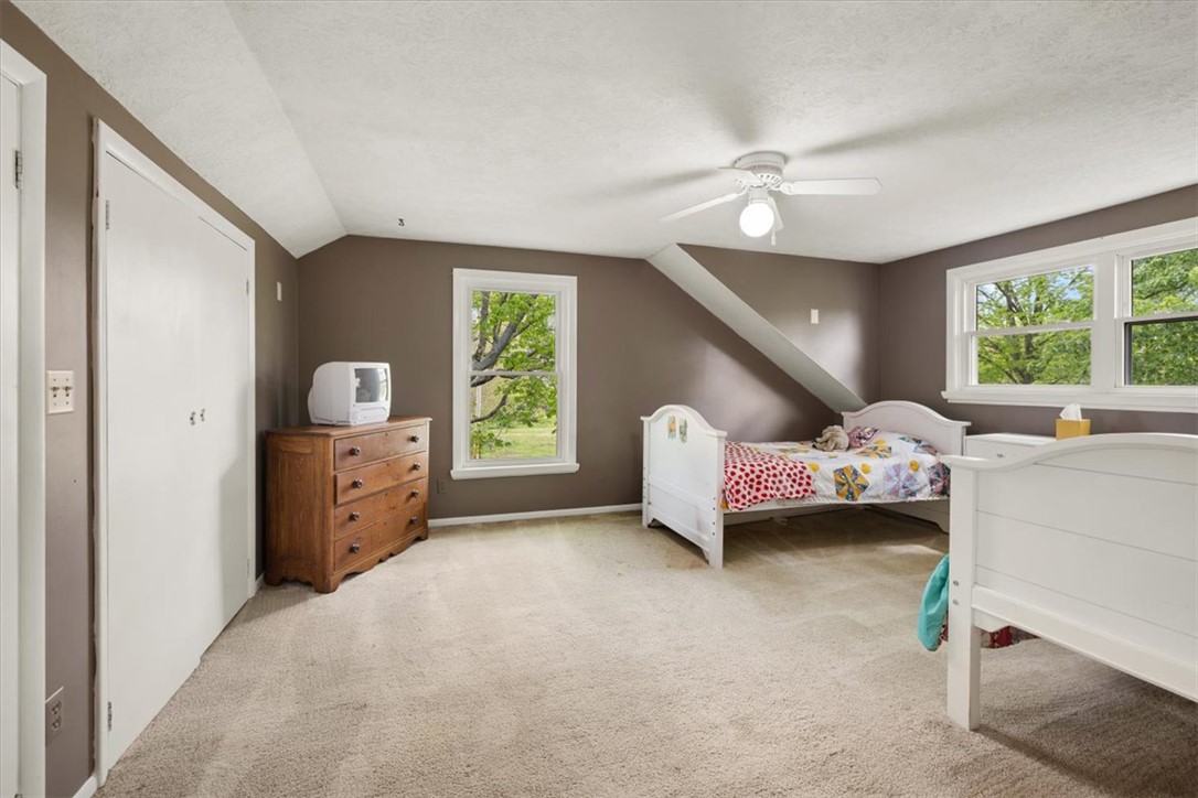 5120 Wheelock Road Troy, OH 45373 - Photo 28 of 67 This spacious bedroom offers ample natural light and a comfortable atmosphere for rest and relaxation.