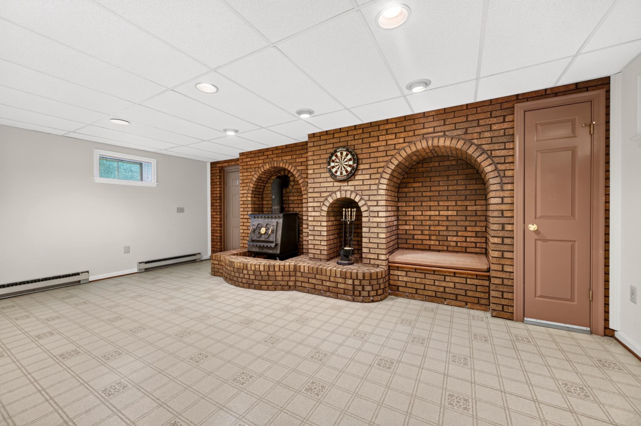 24513 Hanson Road Laytonsville, MD 20882 - Photo 40 of 58 Cozy Lower Level with charming brick accents.