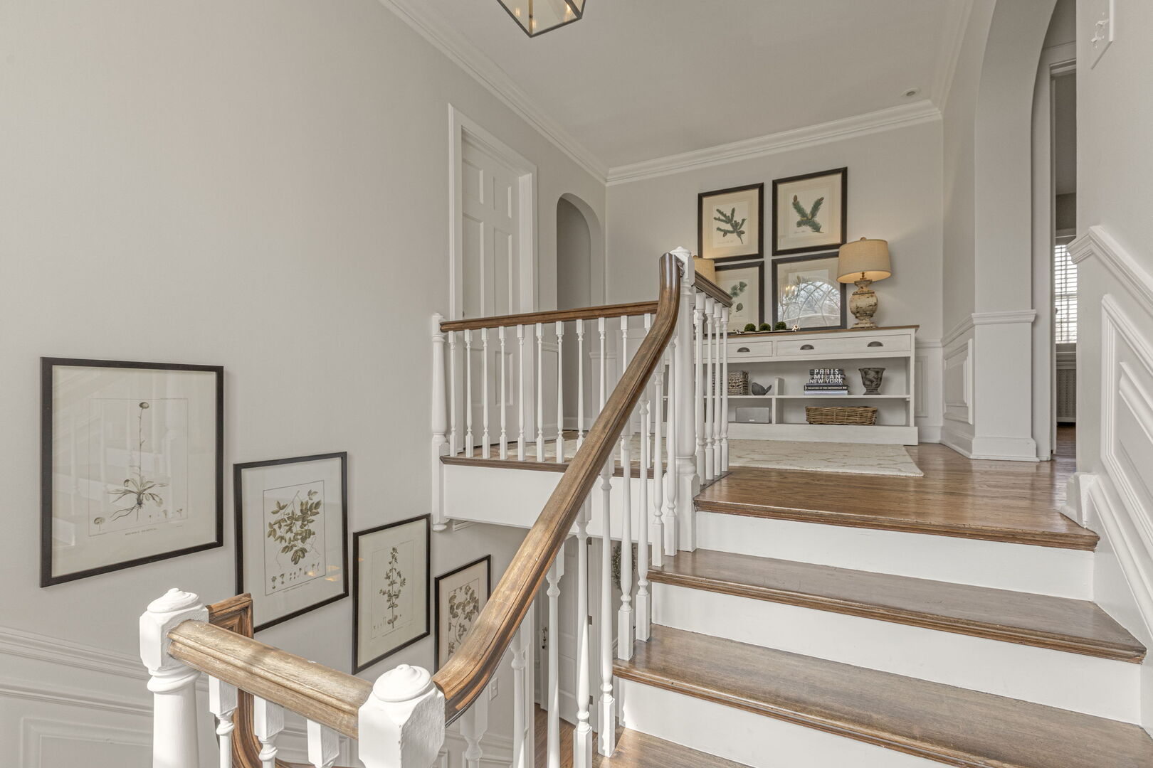 965 Castlegate Court Lake Forest, IL 60045 - Photo 27 of 48 a view of staircase with lots of frames on wall and a window