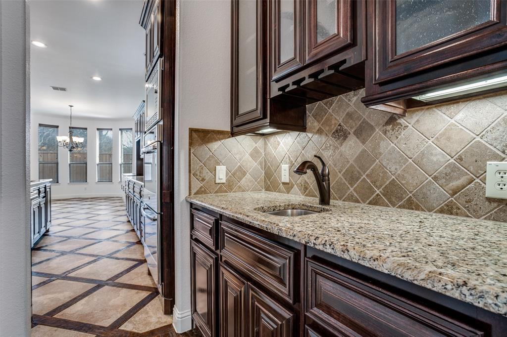 900 Jessica Lane Prosper, TX 75078 - Photo 12 of 40 a view of a sink and dishwasher