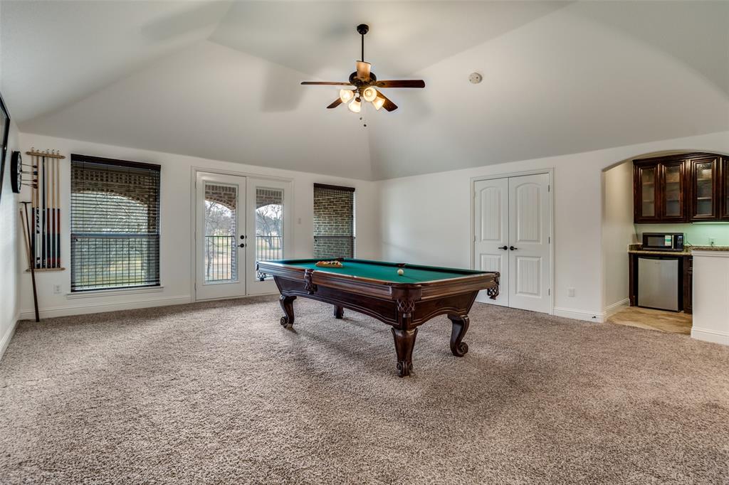 900 Jessica Lane Prosper, TX 75078 - Photo 23 of 40 a living room with furniture and a ceiling fan