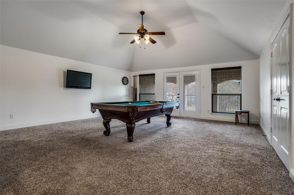 900 Jessica Lane Prosper, TX 75078 - Photo 25 of 40 a living room with furniture and a flat screen tv