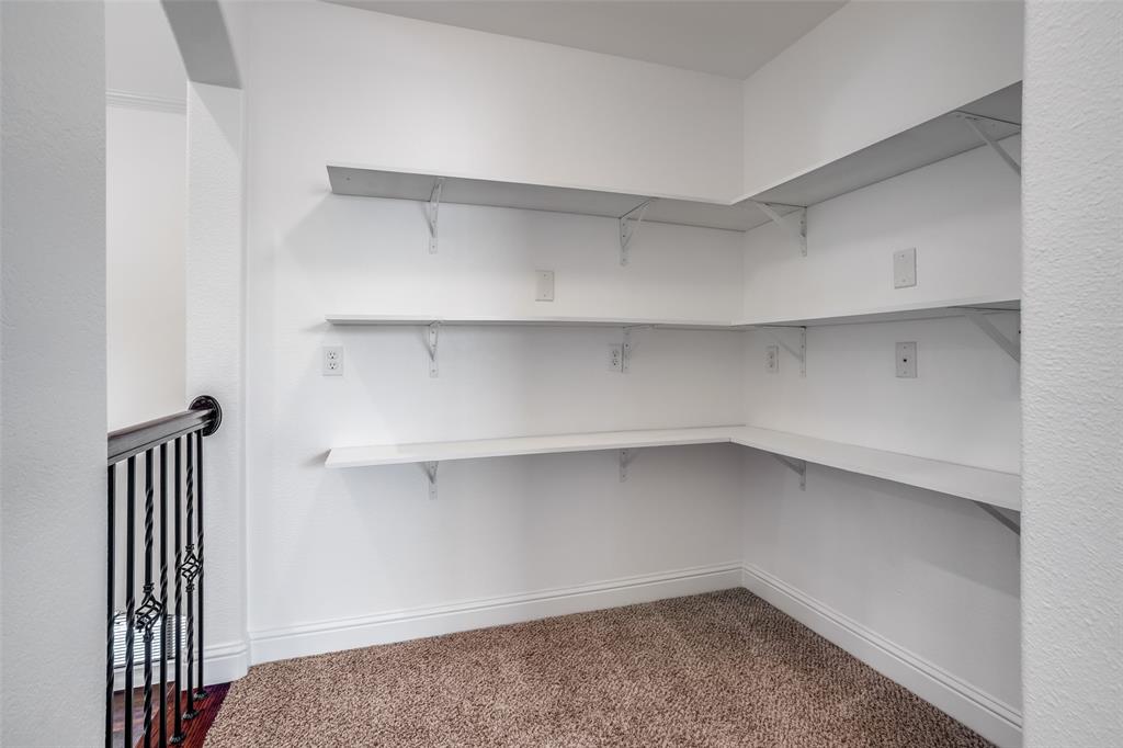 900 Jessica Lane Prosper, TX 75078 - Photo 29 of 40 a view of walk in closet with empty racks