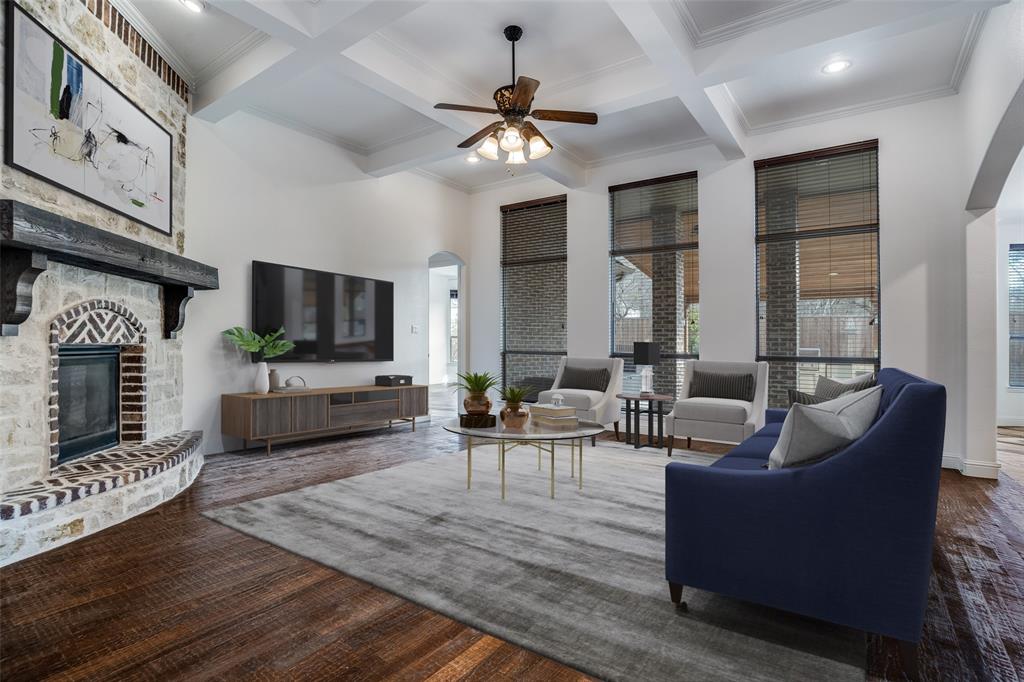 900 Jessica Lane Prosper, TX 75078 - Photo 3 of 40 a living room with furniture a fireplace and a flat screen tv