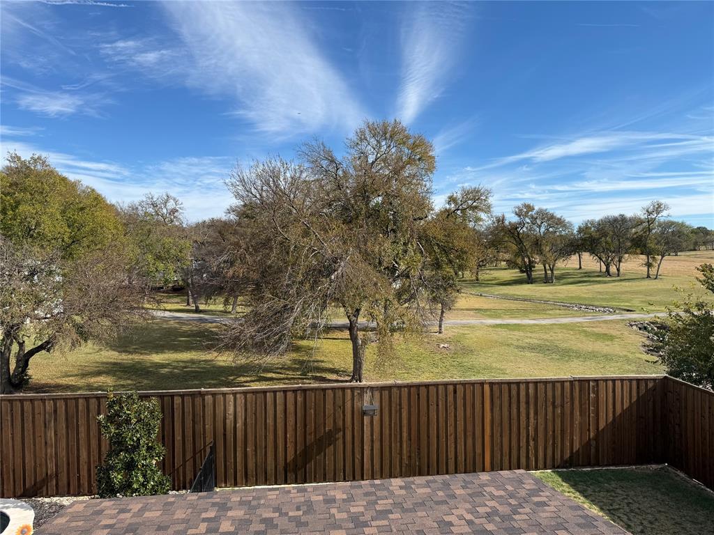 900 Jessica Lane Prosper, TX 75078 - Photo 32 of 40 a view of a yard with wooden fence