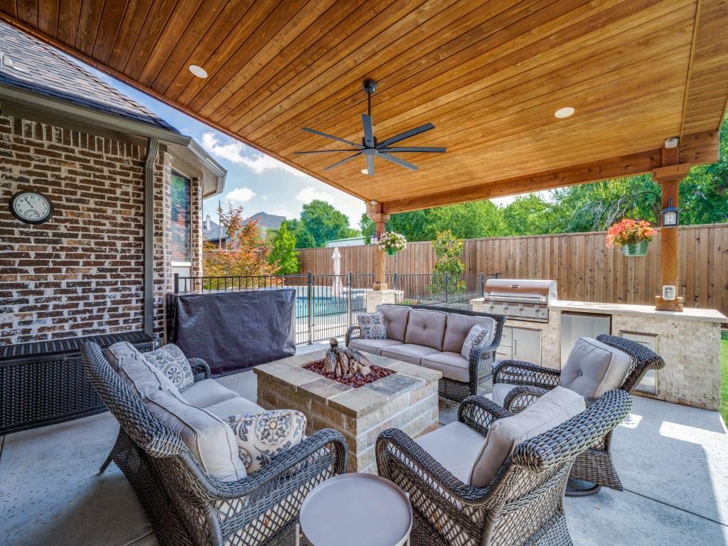 900 Jessica Lane Prosper, TX 75078 - Photo 33 of 40 a view of a patio with a table and chairs