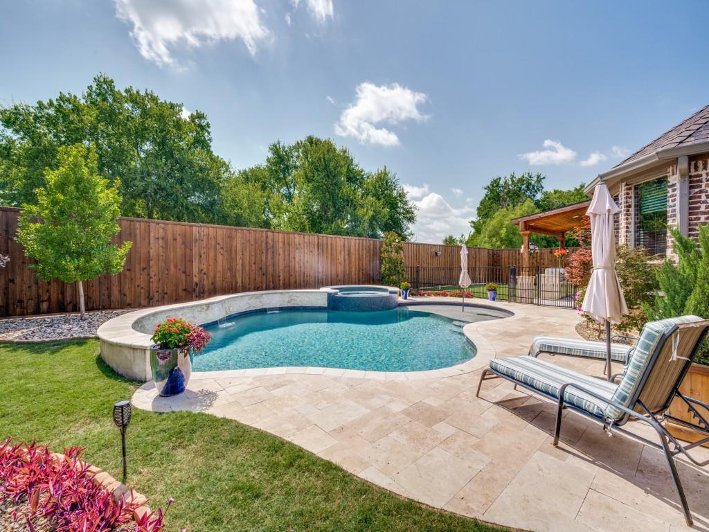 900 Jessica Lane Prosper, TX 75078 - Photo 37 of 40 a view of a backyard with a garden and entertaining space