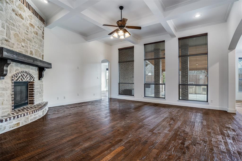 900 Jessica Lane Prosper, TX 75078 - Photo 4 of 40 a view of an empty room with wooden floor and a window