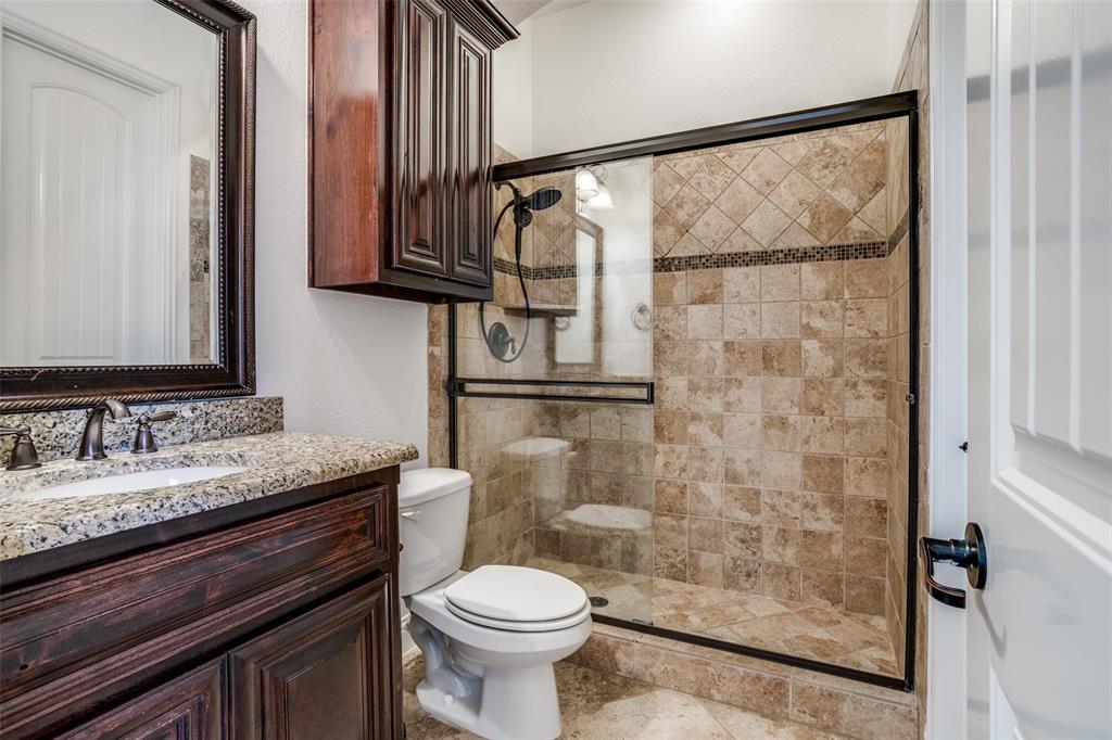 900 Jessica Lane Prosper, TX 75078 - Photo 6 of 40 Full bathroom off the office/or bedroom with vanity and a stall shower