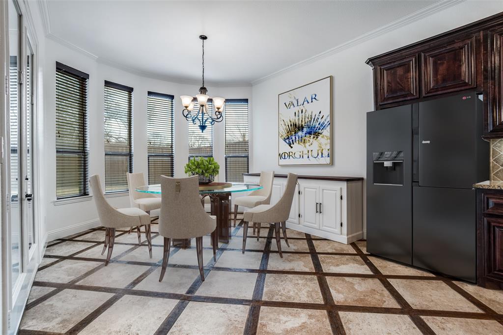 900 Jessica Lane Prosper, TX 75078 - Photo 7 of 40 a view of a dining room with furniture a chandelier and window