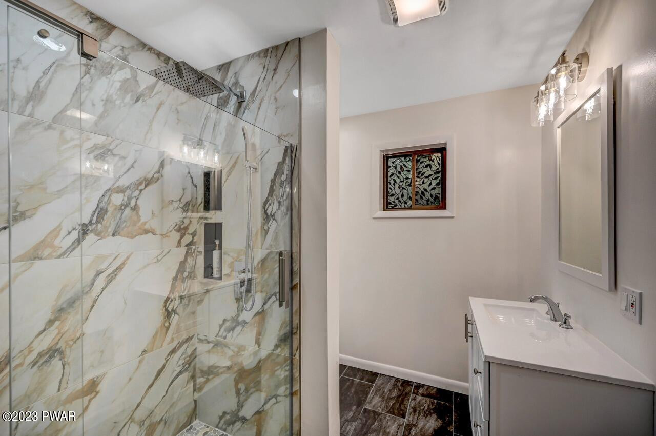 3238 Northgate Road Lake Ariel, PA 18436 - Photo 20 of 49 a bathroom with a sink vanity granite and shower