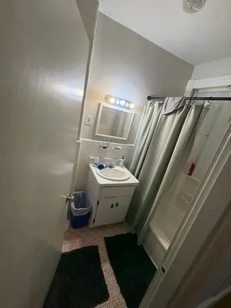 a bathroom with a sink and mirror