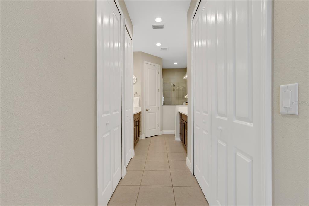 3325 Azurite Way Lakewood Ranch, FL 34211 - Photo 20 of 46 a view of a hallway with a livingroom and a bathroom