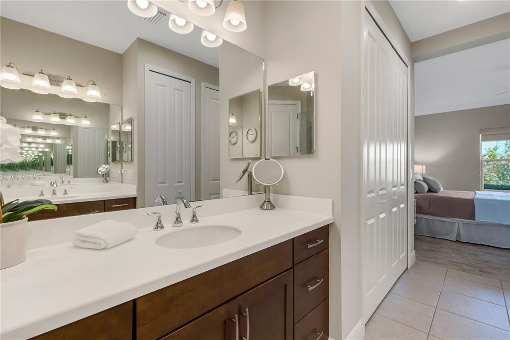 3325 Azurite Way Lakewood Ranch, FL 34211 - Photo 22 of 46 a bathroom with a sink vanity granite tub and a mirror