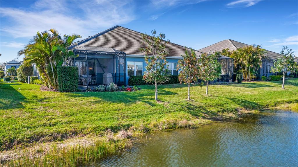 3325 Azurite Way Lakewood Ranch, FL 34211 - Photo 31 of 46 a front view of a house with swimming pool having outdoor seating