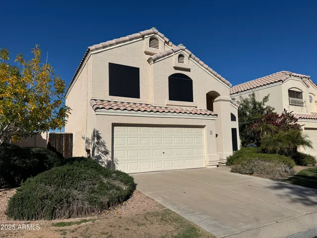 a view of a white house with a white door