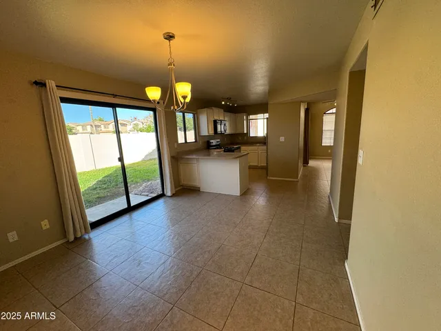 a view of a kitchen with a sink and a window