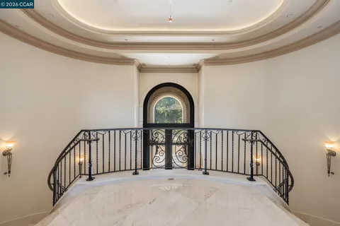 a spacious bathroom with a mirror a double vanity sink and a shower