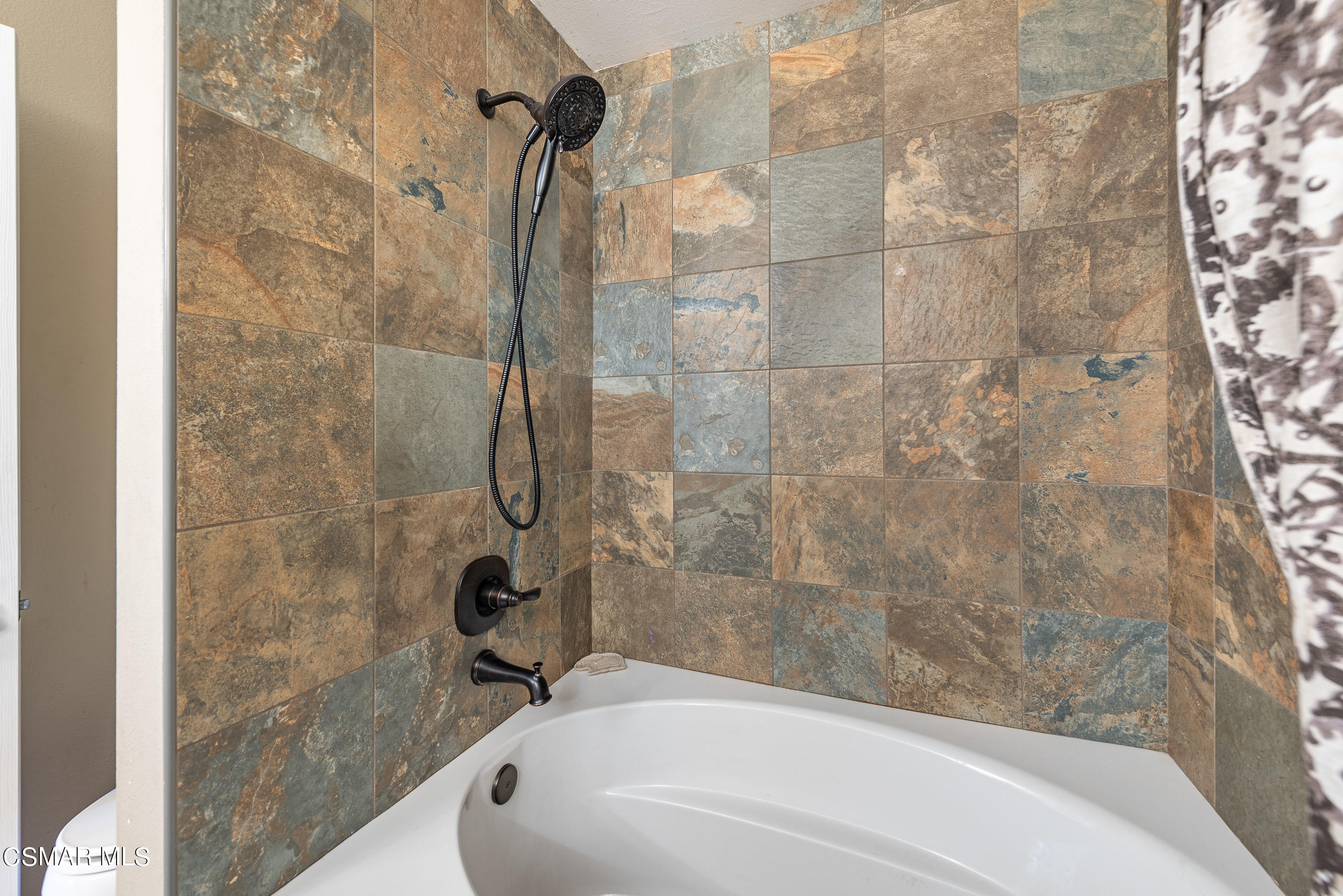 1928 Stow Street Simi Valley, CA 93063 - Photo 20 of 31 a bathroom with a bathtub and shower