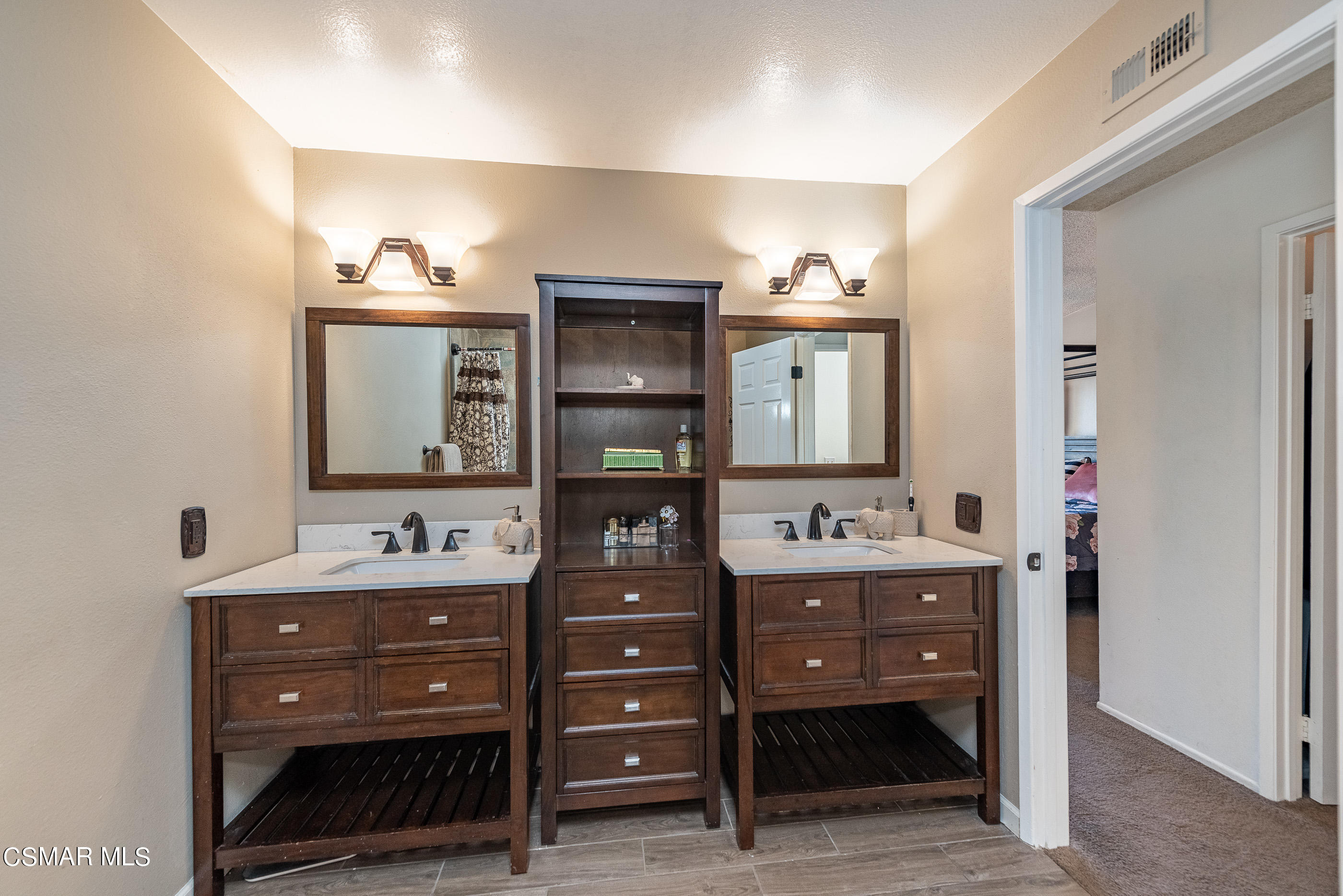 1928 Stow Street Simi Valley, CA 93063 - Photo 21 of 31 a bathroom with a double vanity sink and mirror