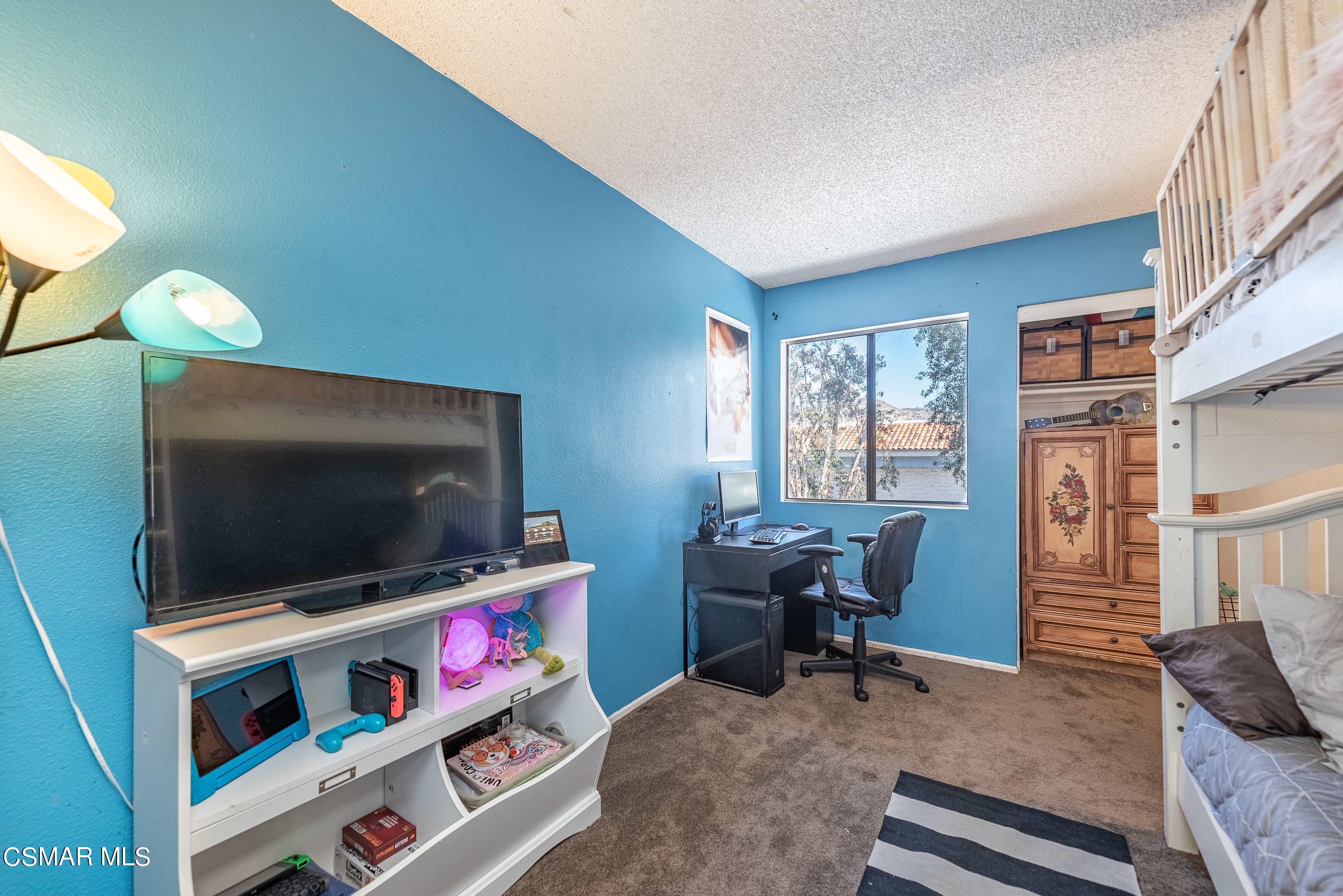 1928 Stow Street Simi Valley, CA 93063 - Photo 26 of 31 a living room with furniture and a flat screen tv