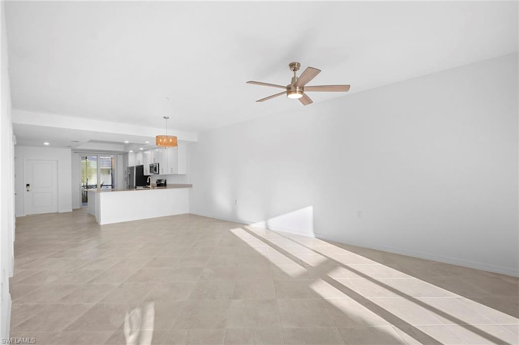 15155 Bluffton Lane, Unit 517 Babcock Ranch, FL 33982 - Photo 20 of 39 a view of a big room with closet and chandelier fan
