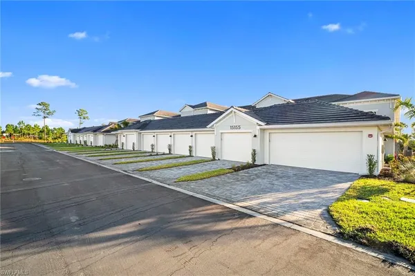 a view of a lake with houses in the background