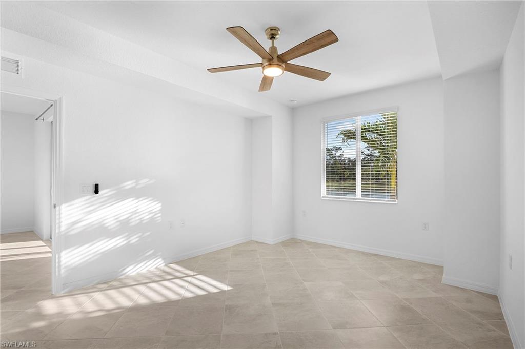 15155 Bluffton Lane, Unit 517 Babcock Ranch, FL 33982 - Photo 23 of 39 a view of a livingroom with a ceiling fan and window