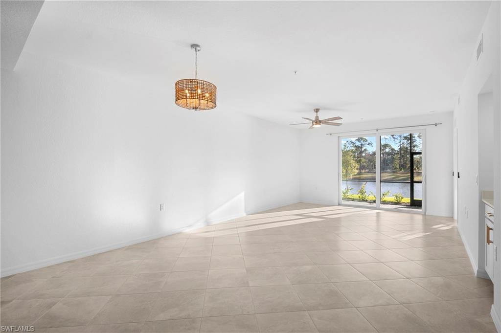 15155 Bluffton Lane, Unit 517 Babcock Ranch, FL 33982 - Photo 28 of 39 an empty room with windows and natural light