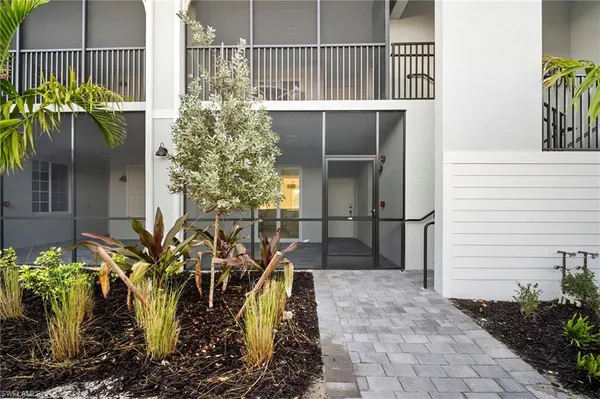 a view of a lake with houses in the back