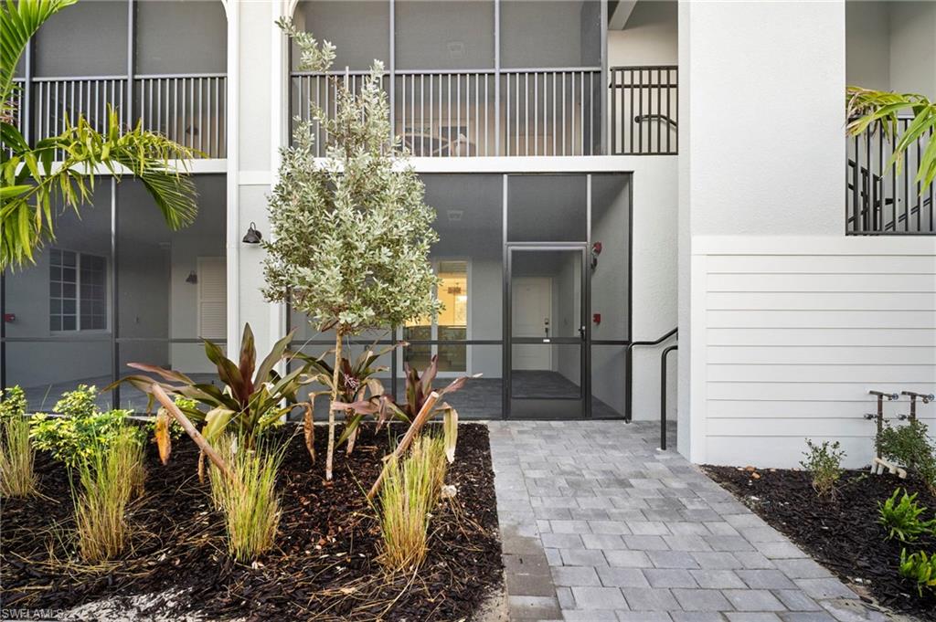 15155 Bluffton Lane, Unit 517 Babcock Ranch, FL 33982 - Photo 32 of 39 a view of a potted plants with wooden fence