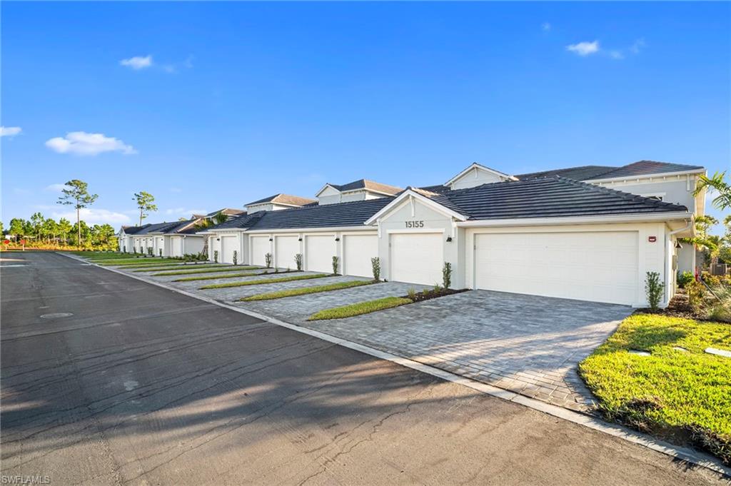 15155 Bluffton Lane, Unit 517 Babcock Ranch, FL 33982 - Photo 38 of 39 a view of front of house with a yard