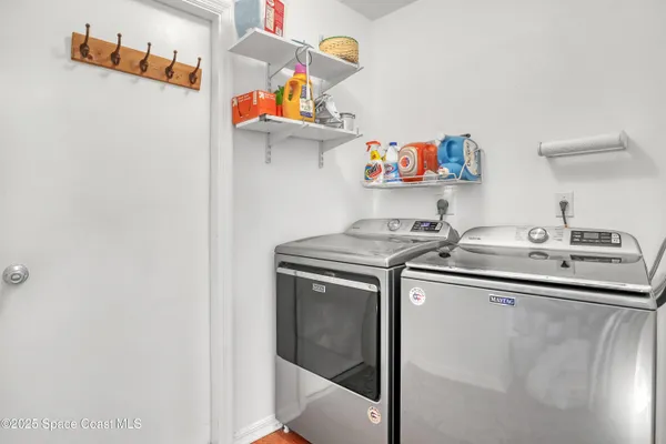 a utility room with dryer and washer