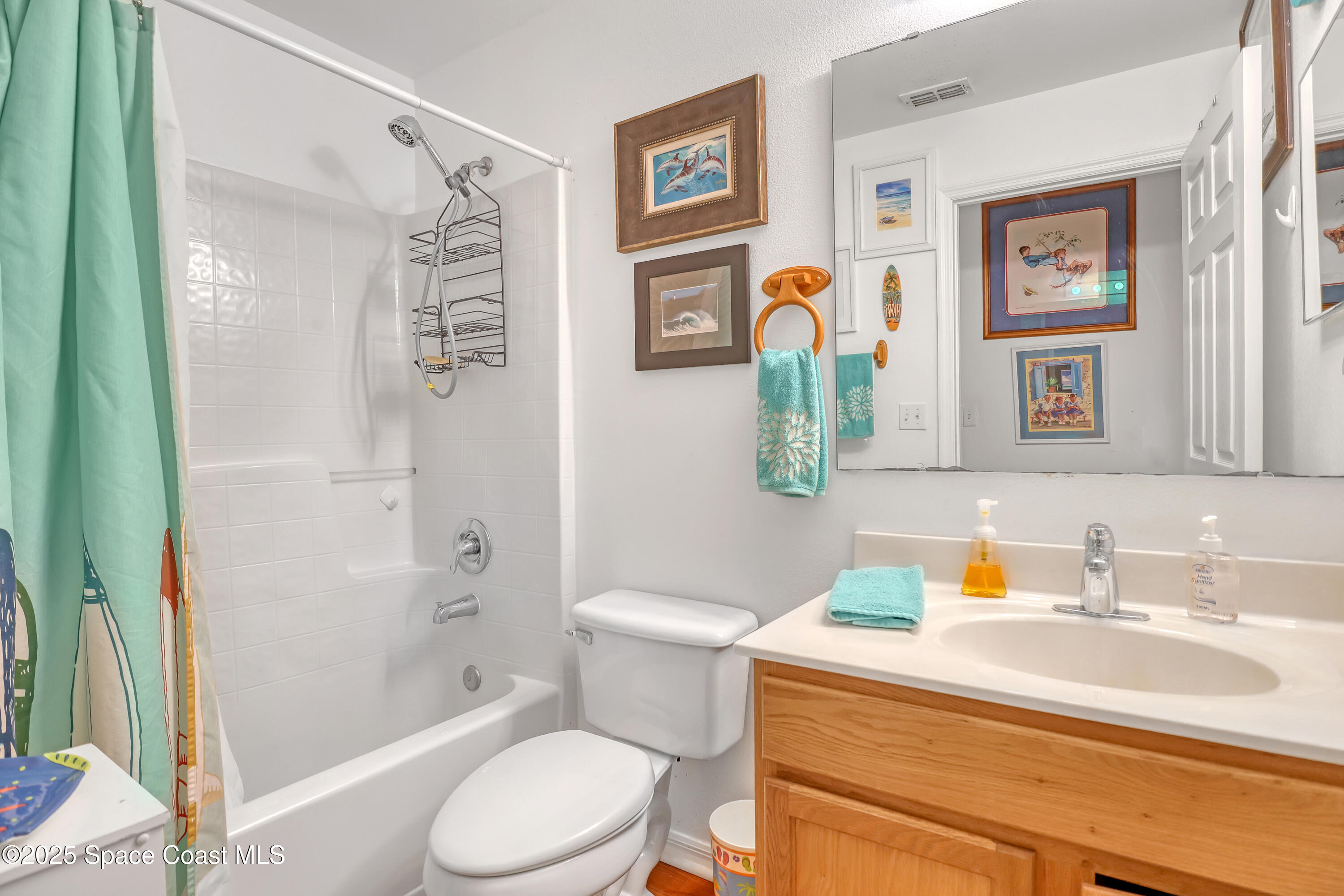 2210 Spring Creek Circle Palm Bay, FL 32905 - Photo 30 of 39 a bathroom with a sink toilet and shower