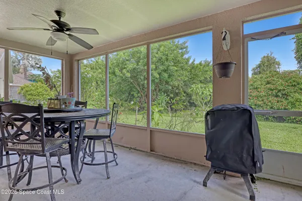 a view of a livingroom with furniture and a window