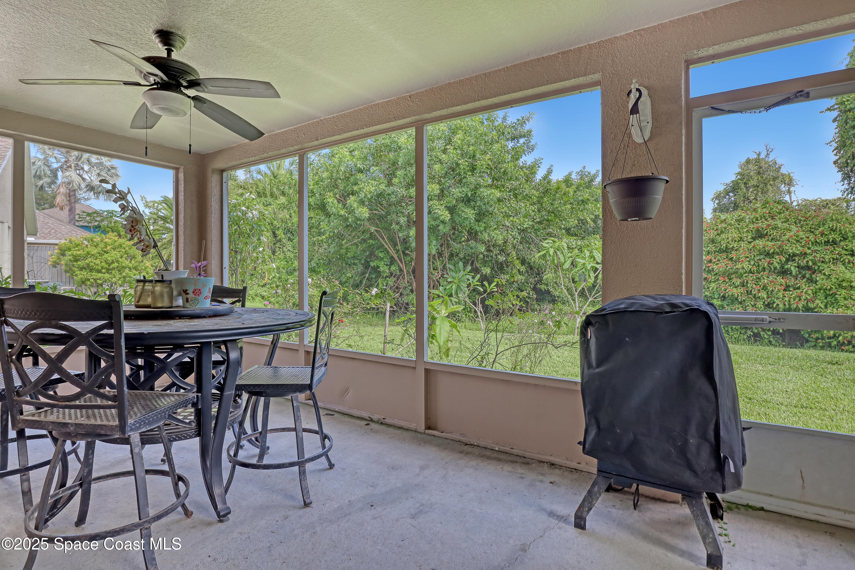 2210 Spring Creek Circle Palm Bay, FL 32905 - Photo 31 of 39 a view of a livingroom with furniture and a window