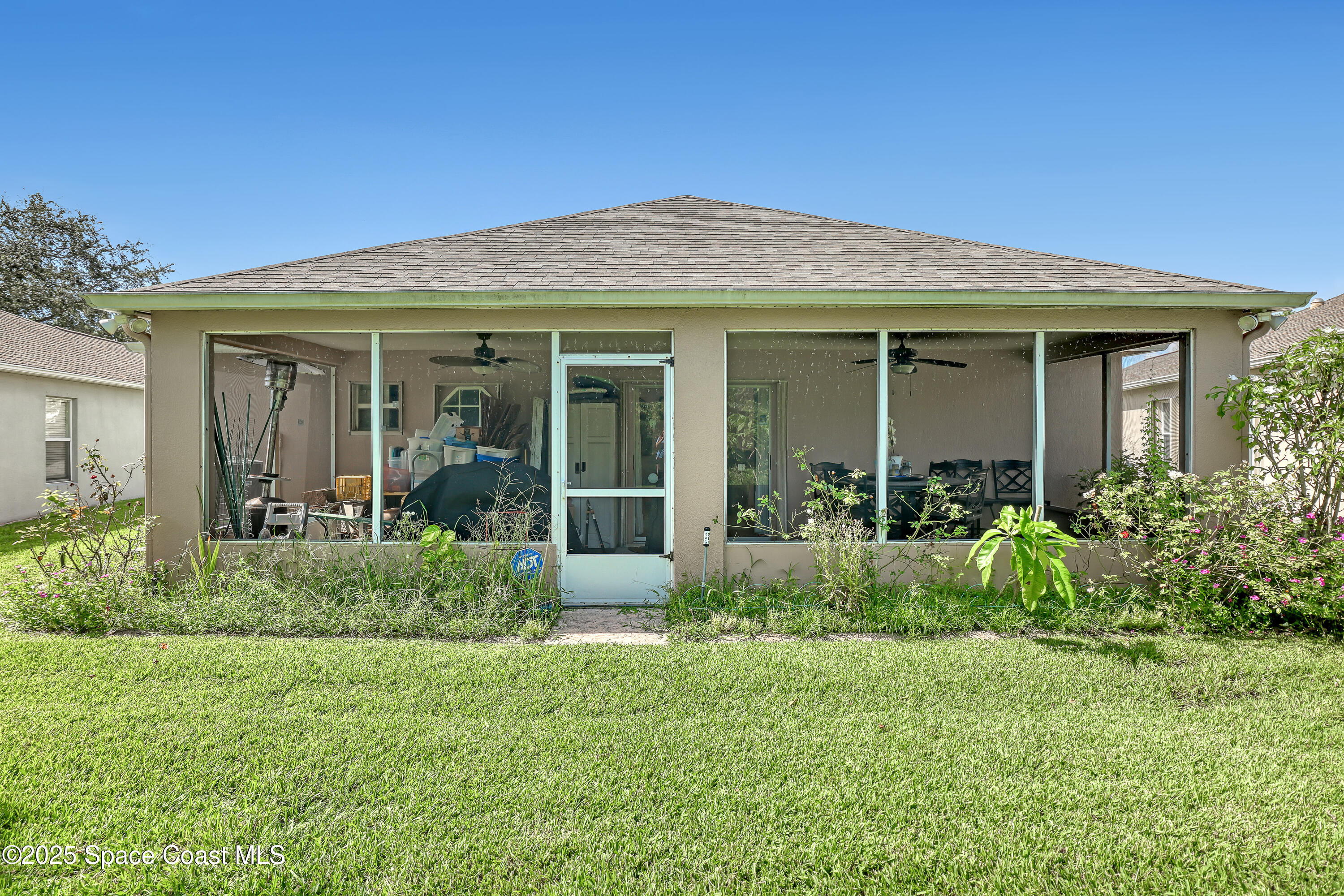 2210 Spring Creek Circle Palm Bay, FL 32905 - Photo 33 of 39 front view of a house with a yard