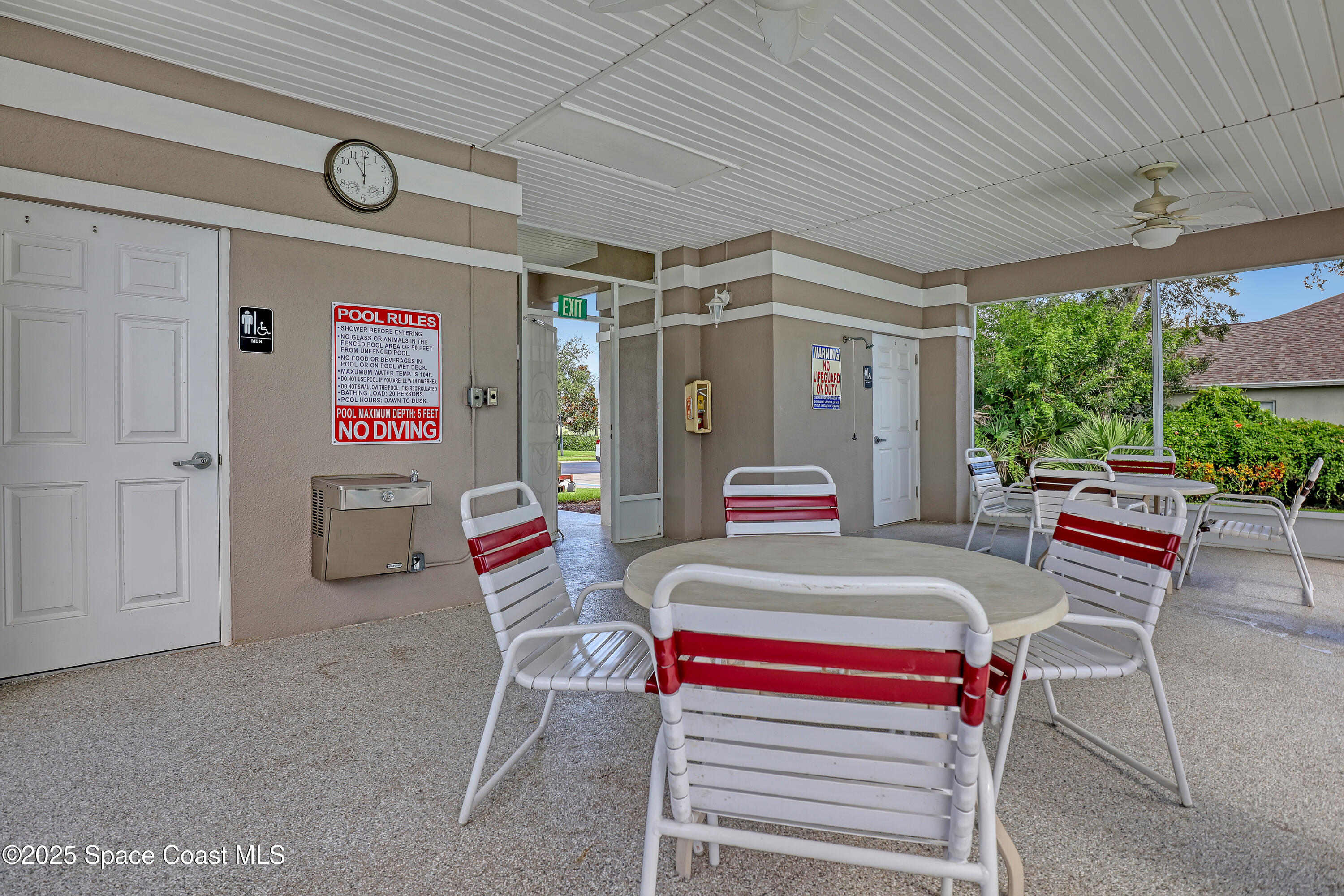 2210 Spring Creek Circle Palm Bay, FL 32905 - Photo 35 of 39 a outdoor space that has a couch and a table in it