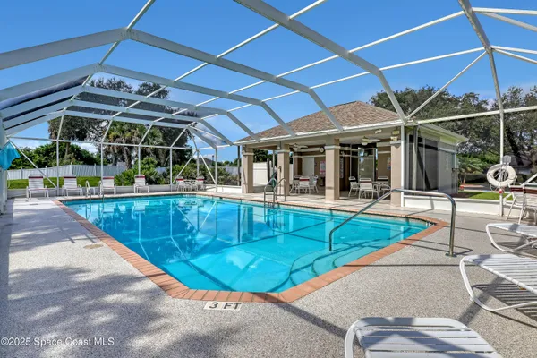 a view of a swimming pool with a patio