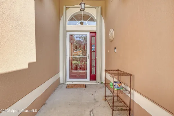 a view of front door with wooden door