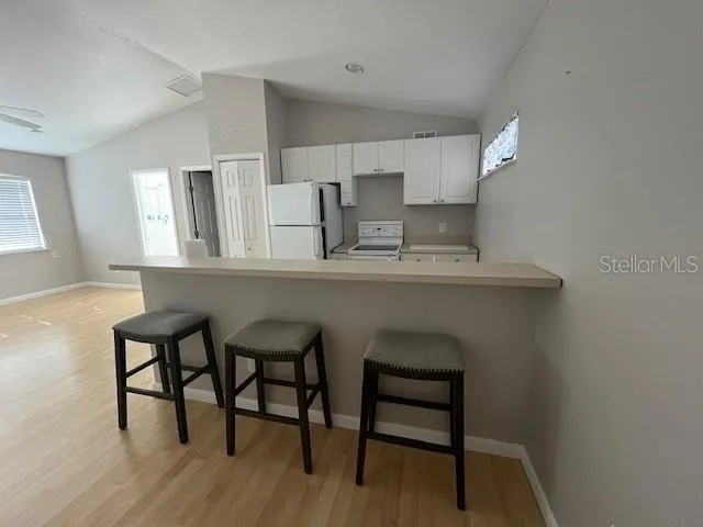 a bathroom with a shower a toilet and a window