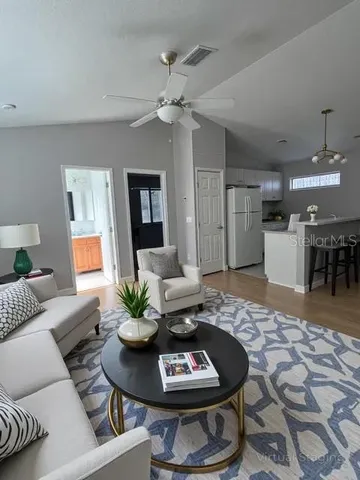 a utility room with wooden floor washer and dryer