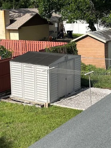 a house with potted plants in front of it