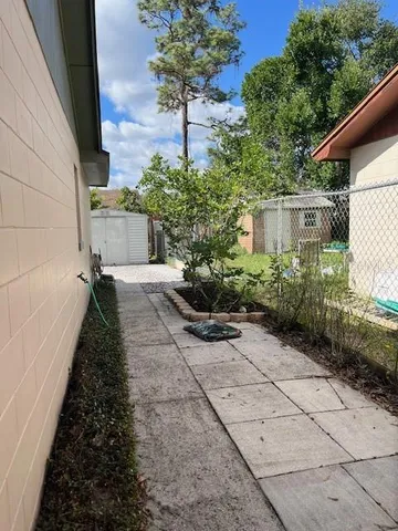 a house view with a garden space