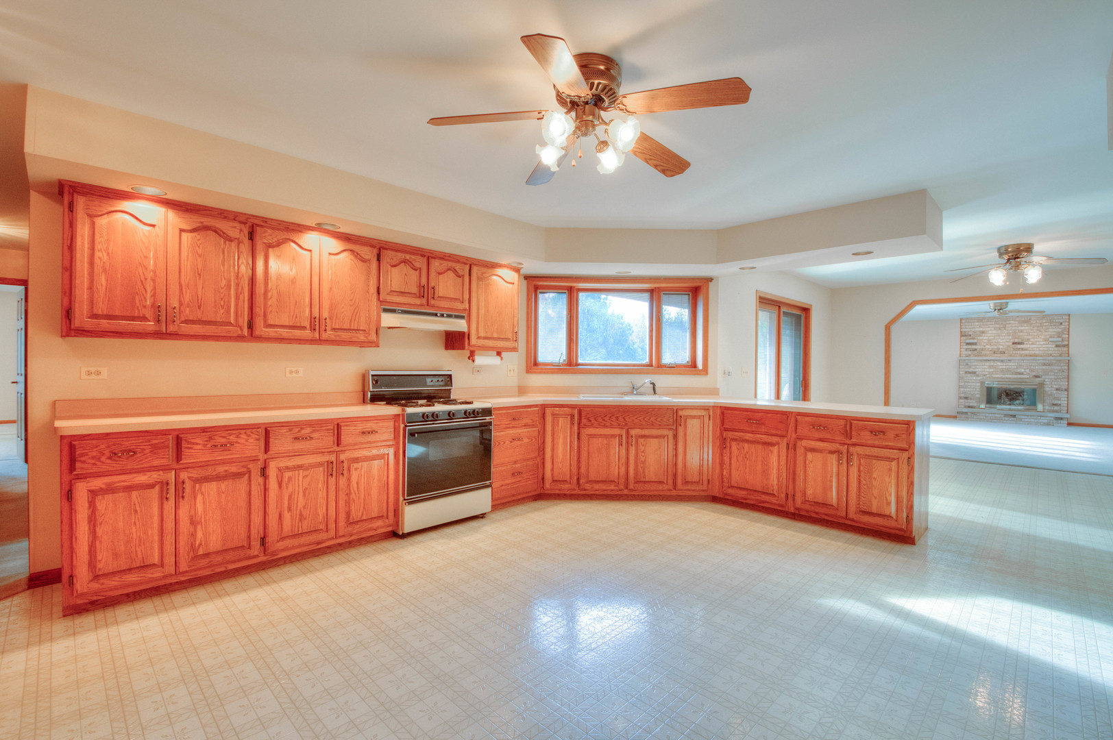 20501 Hebron Road Harvard, IL 60033 - Photo 17 of 49 a kitchen with stainless steel appliances granite countertop a stove a sink and a refrigerator